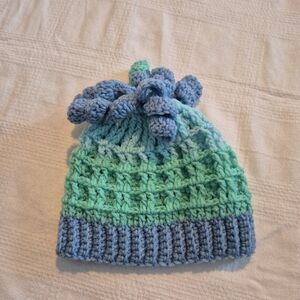 Hand made 6-12 months blue & green waffle hat with curlies on top NEW